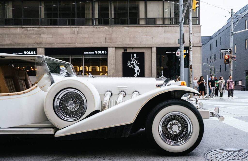 wedding car travelling in roads with bride & groom