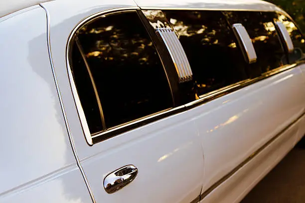 sunset reflections in stretch limousine windows, shallow depth of field